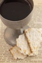 The Holy Communion in a Pewter Goblet with an Antique Bible Royalty Free Stock Photo