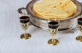 Holy communion on wooden table in church cup of glass with red wine, bread Royalty Free Stock Photo