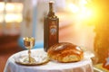 Holy communion on wooden table in church.Taking Communion.Cup of glass with red wine, bread on table.The Feast of Corpus Christi Royalty Free Stock Photo