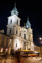 Holy Cross Church at night in Warsaw