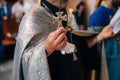The Holy Cross in the hands of a priest, close up