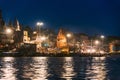 Holy Dasaswamedh Ghat with light reflected on the river that view from the boat at Varanasi Ganga Aarti.
