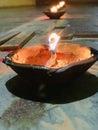 Holy glowing flame of lamp or group of diya glowing at night symbolized peace and harmony