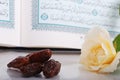 Holy Islam book some dates and rose Royalty Free Stock Photo