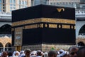 Holy Kaaba close up view. Muslim pilgrims around Kaaba. Saudi Arabia - Mecca