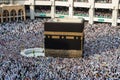 Holy Kaaba. Crowd of muslims walking around Kaaba for Tawaf during Hajj