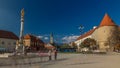 Holy Mary monument on square in front of the Cathedral timelapse hyperlapse and Historic buildings in citycentre in