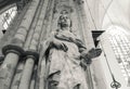 Holy Mary Virgin Big Stone Statue in Brussels Cathedral from Below with Columns Behind (B&W)