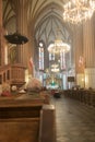 Holy mass with priest and a few elderly people in catholic cathedral church in Poland