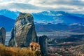 The Holy Monastery of Roussanou among the steep cliffs, with Kastraki village and mountains panorama, Kalampaka, Trikala, Thessaly