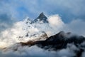 Machapuchare, Fish Tail Mountain rising above the clouds from the Annapurna base camp trail, Nepal Royalty Free Stock Photo