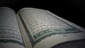 Holy Qur'an selective focus with black background. The Qur'an is the holy book of Muslims, written in Arabic. Royalty Free Stock Photo