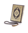 Holy Quran Book and Rosary on White Background