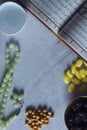 Holy Quran, Rosary, Iftar sweets and dried fruits with a cup of water. View from above. Flat lay photo Royalty Free Stock Photo