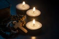 Holy Rosary, Bible and burning candles with customizable space for religious text or ideas. Copy space and religion Royalty Free Stock Photo