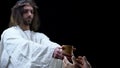Holy savior giving cup of water poor man, religious mercy, kindness and charity