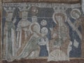 the holy three kings handing over their gifts to the christ child, an ancient fresco in Keldeby church