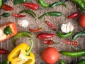 The holy trinity of capcicum bell pepper onion tomato garlic and chilli peppers over a grill. Royalty Free Stock Photo