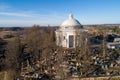 Holy Trinity Church in Suderve, Vilnius district, Lithuania. Cemetery in foreground. Drone Royalty Free Stock Photo