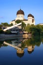 The `Holy Trinity` Orthodox Cathedral from Arad mirrored in the lake water from the Padurice park.