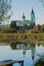 Holy Trinity russian orthodox convent with its reflection of surface of river Riv from the opposite bank in Brayiliv