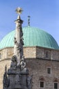 Holy Trinity statue with the mosque of pasha Qasim the Victorious in Pecs