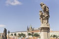 Holy virgin and saint anne baroque sculpture at charles bridge with prague castle Royalty Free Stock Photo