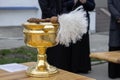 Holy water bowl and sprinkler, consecration on a Church holiday with Holy water. Royalty Free Stock Photo