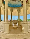 holy water fountain in church with fresco on ceiling Royalty Free Stock Photo