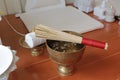 Holy water mixed and flower petals with perfume in a golden bowl by monk in Buddhist merit of Thai. For Blessing or Holy water in