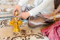 Holy water pouring ceremony with bride and groom hands, Thai traditional wedding engagement Royalty Free Stock Photo