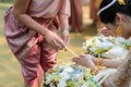 Holy water pouring ceremony over bride and groom hands, Thai traditional wedding engagement Royalty Free Stock Photo