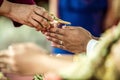 Holy water pouring ceremony over bride and groom hands, Thai traditional wedding engagement Royalty Free Stock Photo