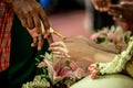 Holy water pouring ceremony over bride and groom hands, Thai traditional wedding engagement Royalty Free Stock Photo