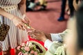 Holy water pouring ceremony over bride and groom hands, Thai traditional wedding engagement Royalty Free Stock Photo