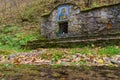 Holy water source in the forest with wildlife. Illustrative editorial. October 24, 2021 Kalarashovka Moldova Royalty Free Stock Photo