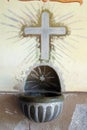 Holy water stoup in the Church of the Visitation of the Blessed Virgin Mary in Stari Farkasic, Croatia