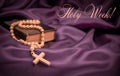 Holy week Bible rosary beads on purple background Royalty Free Stock Photo