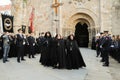 Holy Week in Zamora, Spain, procession of the Ladies of the Virgin of Solitude, lady holding the cross leaving the church.