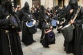 Holy Week in Zamora, Spain, procession of the Virgin of Solitude, little penitent plays the drum among his older companions.