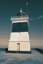 Holyhead Breakwater Lighthouse, on Anglesey in Wales, at the end of a jetty. Royalty Free Stock Photo