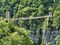 A gravity defying bridge hanging over a cliff