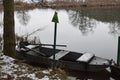 old boat in caldera lake Holzmaar during winter Royalty Free Stock Photo