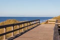 Way of wooden planks leading to the beach of Sylt Royalty Free Stock Photo