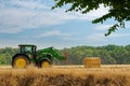 Tractor harvesting crop from the field