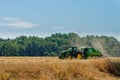 Tractor harvesting crop from the field