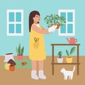 Girl florist and cat at home. Houseplant care