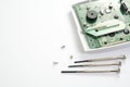 Home alarm control panel repairing. Open Electronic board panel with screwdrivers on a white background. Royalty Free Stock Photo