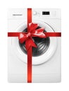 Home appliance - Front view Washing machine gift tied red bow. Isolated