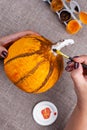 Home autumn crafts from papier mache, pumpkin for Halloween, making process, hobby Royalty Free Stock Photo